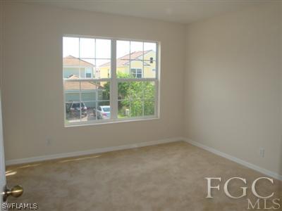 2623 Somerville Loop, Unit 508 Cape Coral, FL 33991 - Photo 6 of 10 an empty room with a window