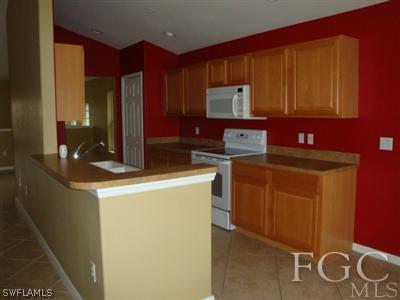 2623 Somerville Loop, Unit 508 Cape Coral, FL 33991 - Photo 8 of 10 a utility room with dryer and washer