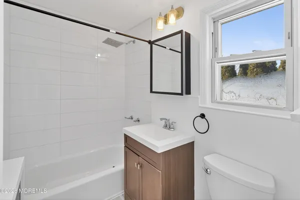 a bathroom with a sink a toilet and a bathtub