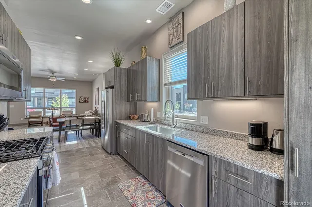 a kitchen with lots of counter top space and living room