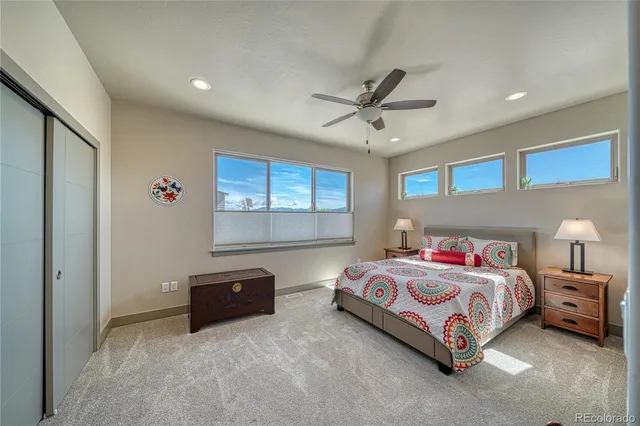 a bedroom with a bed and a tv