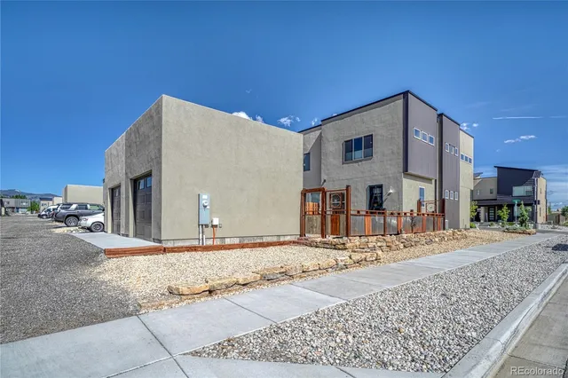 a view of a house with a snow on the road