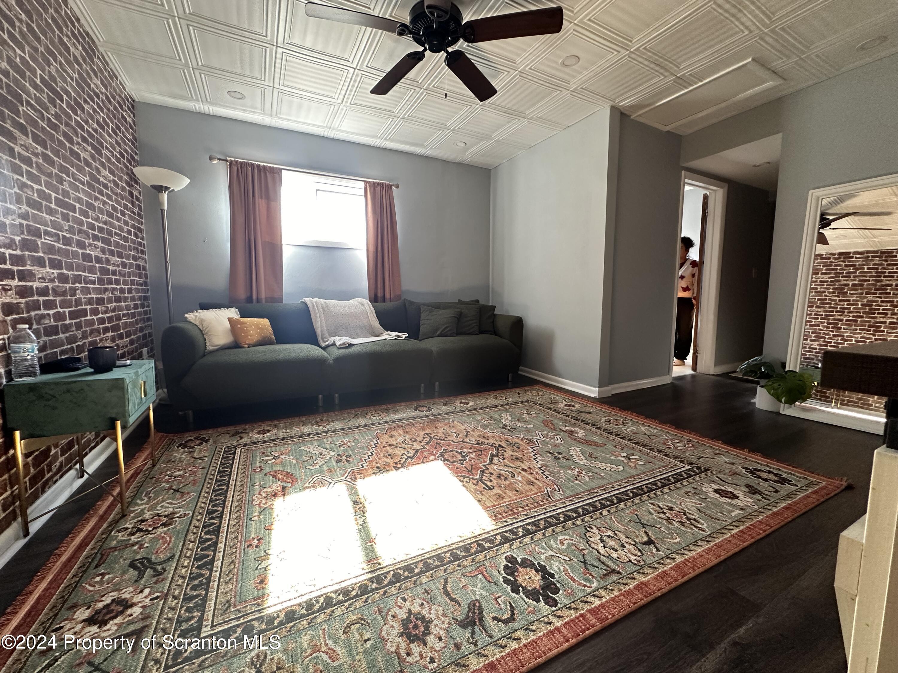 218 Hand Street Jessup, PA 18434 - Photo 4 of 32 a living room with couch and a rug