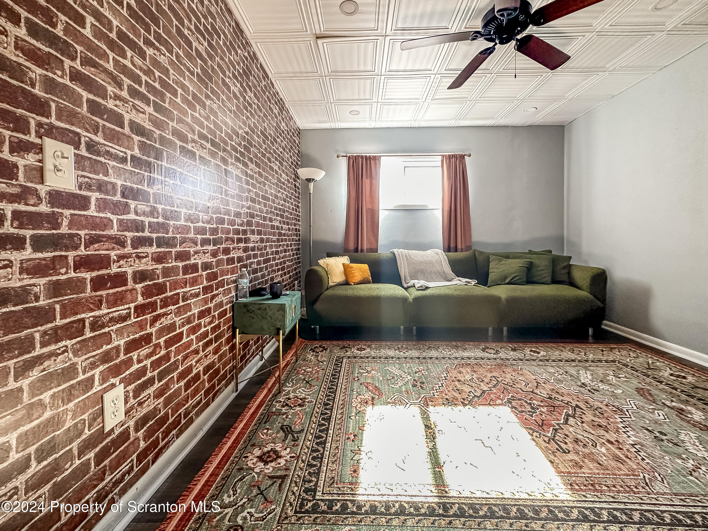 218 Hand Street Jessup, PA 18434 - Photo 7 of 32 a living room with furniture and a rug