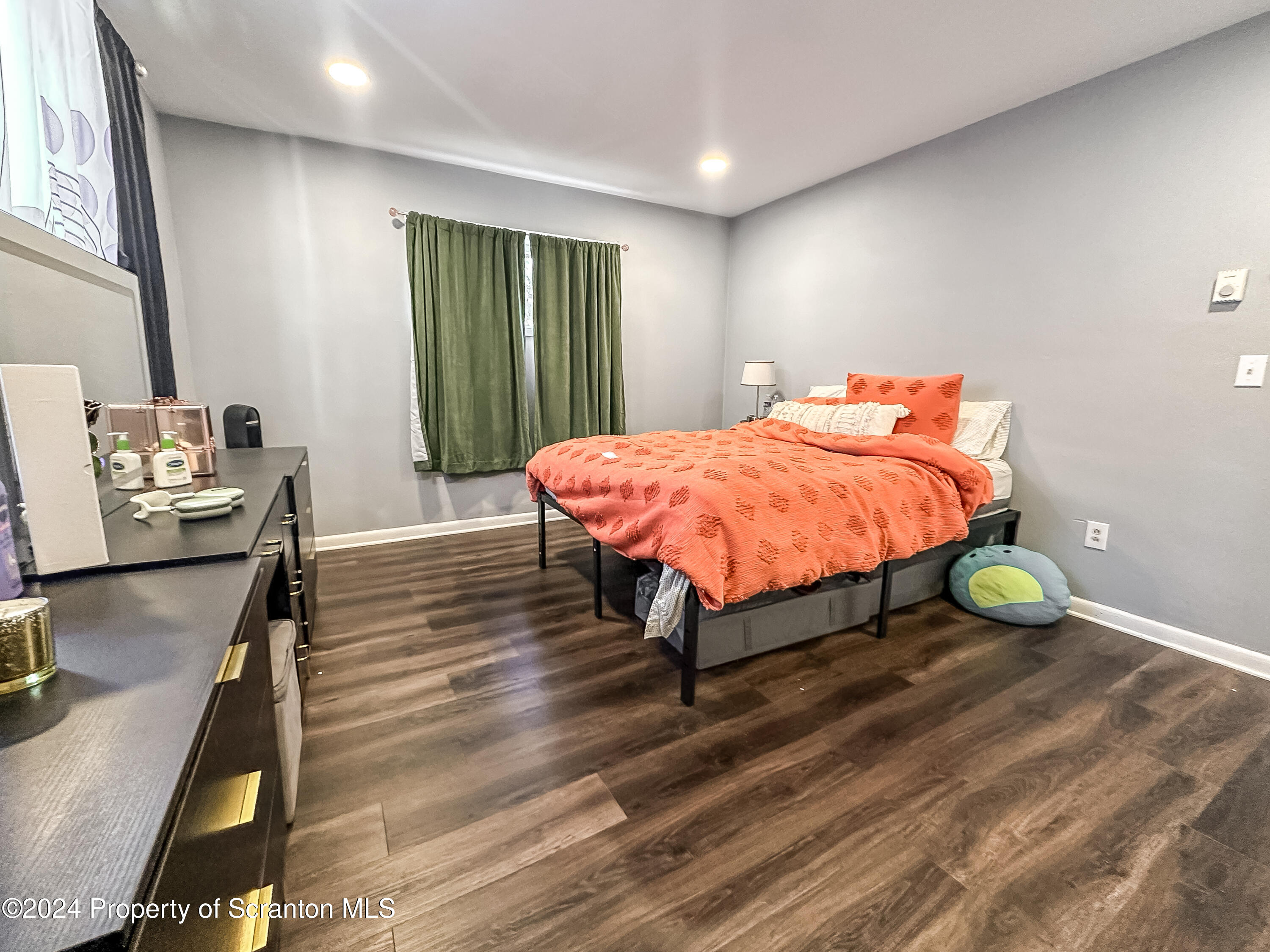 218 Hand Street Jessup, PA 18434 - Photo 8 of 32 a bed room with a bed and table