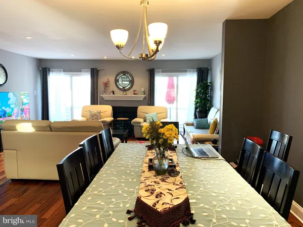 a very nice looking dining room with a large window
