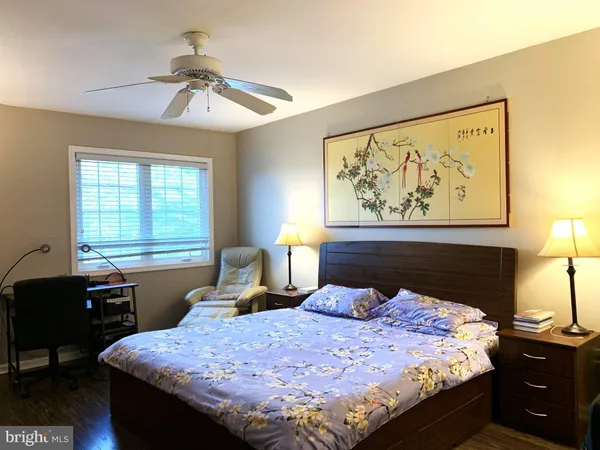 a bedroom with a bed and a table