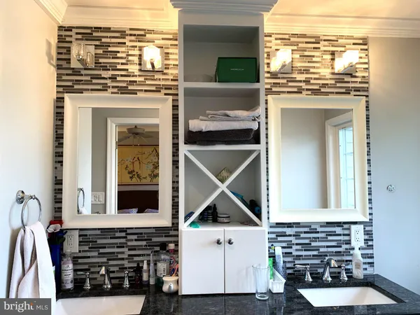 a view of open kitchen with granite countertop a stove and a microwave