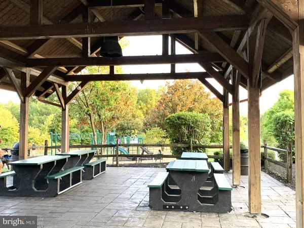 a view of a chairs and table in the patio