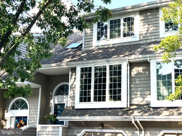 a front view of a house with a porch