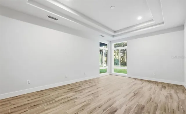 a spacious bathroom with a shower tub double vanity sink and mirror