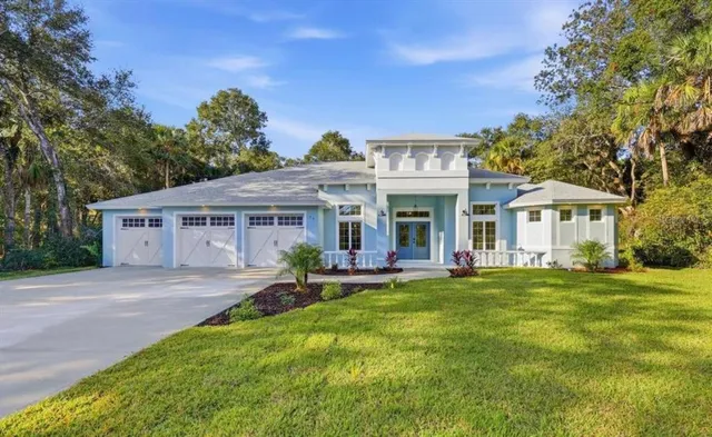a front view of a house with a garden and porch