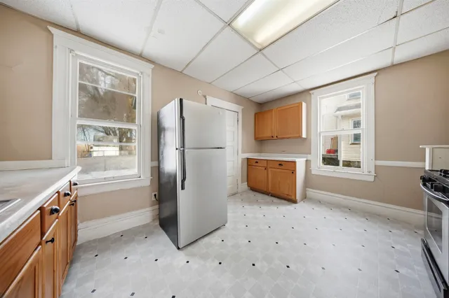 a kitchen with stainless steel appliances a refrigerator and a stove