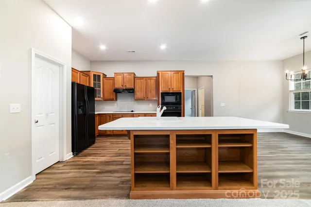 a view of kitchen with wooden floor