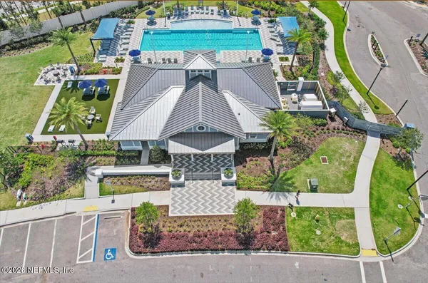 an aerial view of a house with a garden and plants
