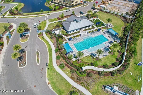 an aerial view of a house with outdoor space