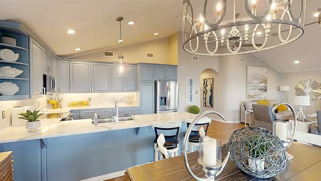 a large kitchen with a table and chairs