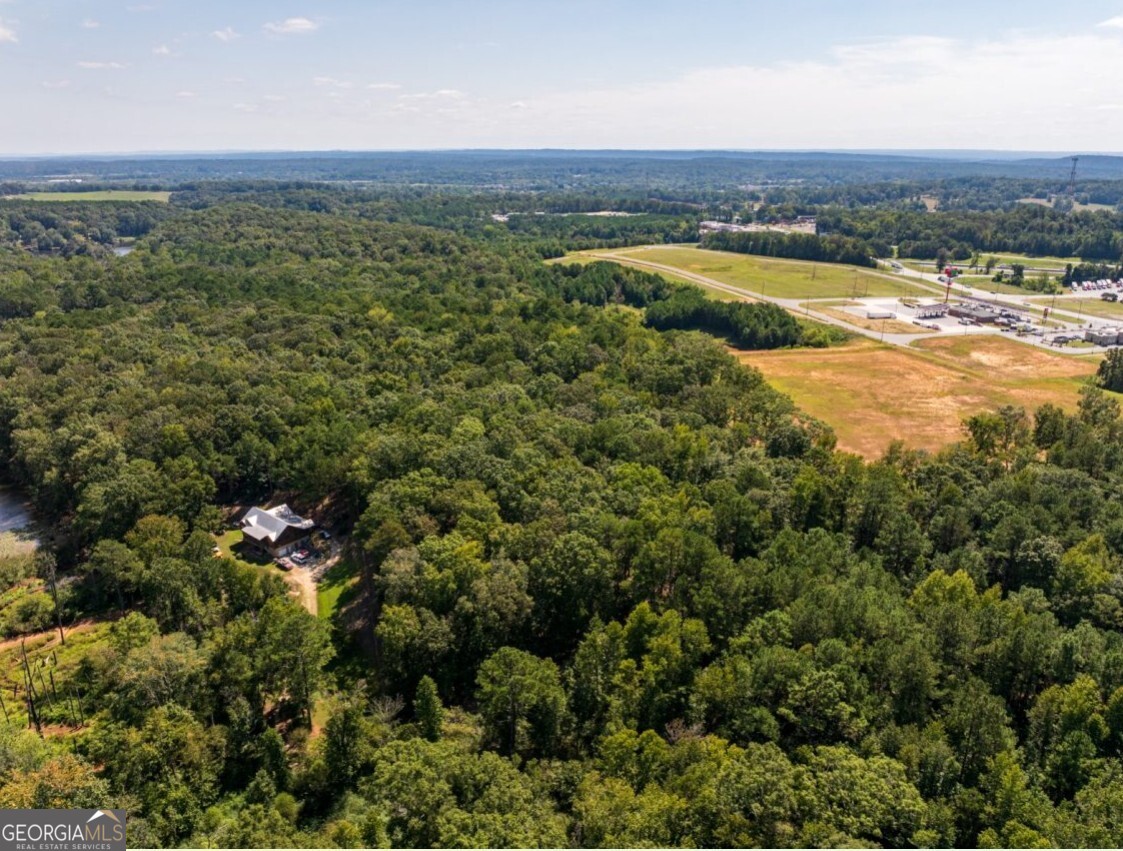 0 Bogan Road McCalla, AL 35111 - Photo 1 of 22 an aerial view of a houses with a yard and lake view