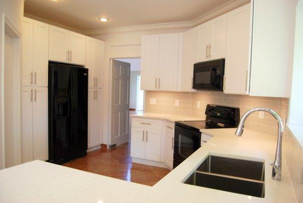 10473 Lake Vista Circle Boca Raton, FL 33498 - Photo 12 of 22 a kitchen with a refrigerator and a stove top oven