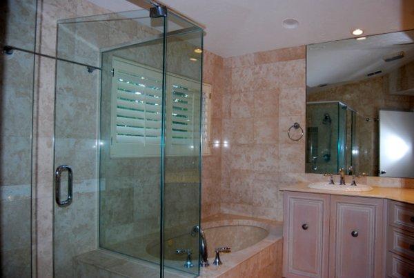10473 Lake Vista Circle Boca Raton, FL 33498 - Photo 17 of 22 a bathroom with a shower a sink and mirror