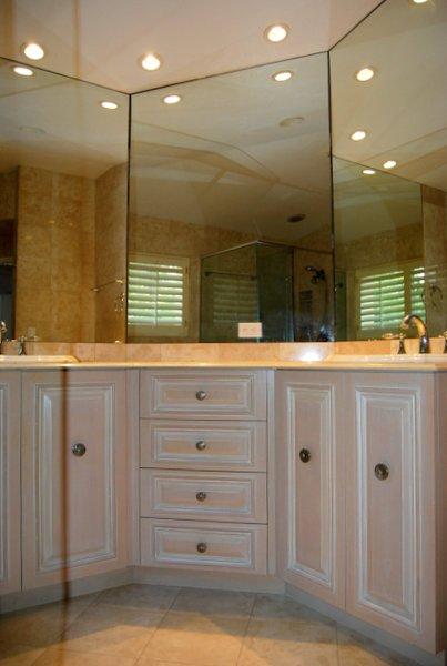 10473 Lake Vista Circle Boca Raton, FL 33498 - Photo 18 of 22 a bathroom with a sink a vanity a large mirror and shower