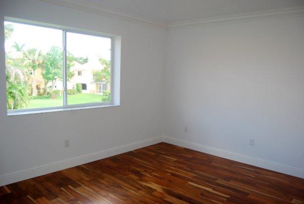 10473 Lake Vista Circle Boca Raton, FL 33498 - Photo 20 of 22 a view of a room with wooden floor and window