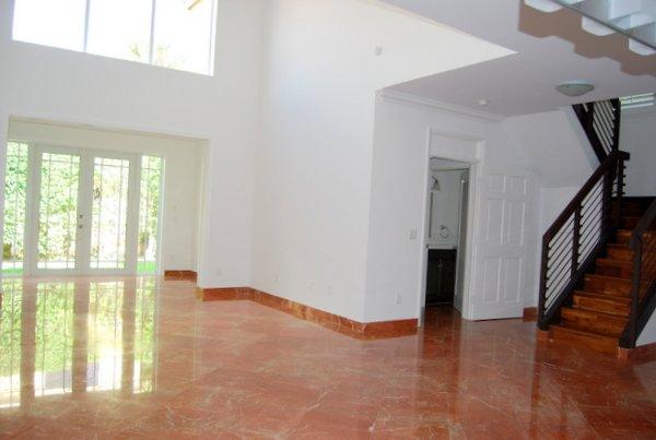 10473 Lake Vista Circle Boca Raton, FL 33498 - Photo 4 of 22 a view of an empty room with wooden floor and a window