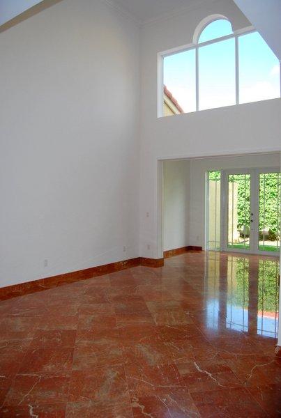 10473 Lake Vista Circle Boca Raton, FL 33498 - Photo 6 of 22 an empty room with wooden floor and windows