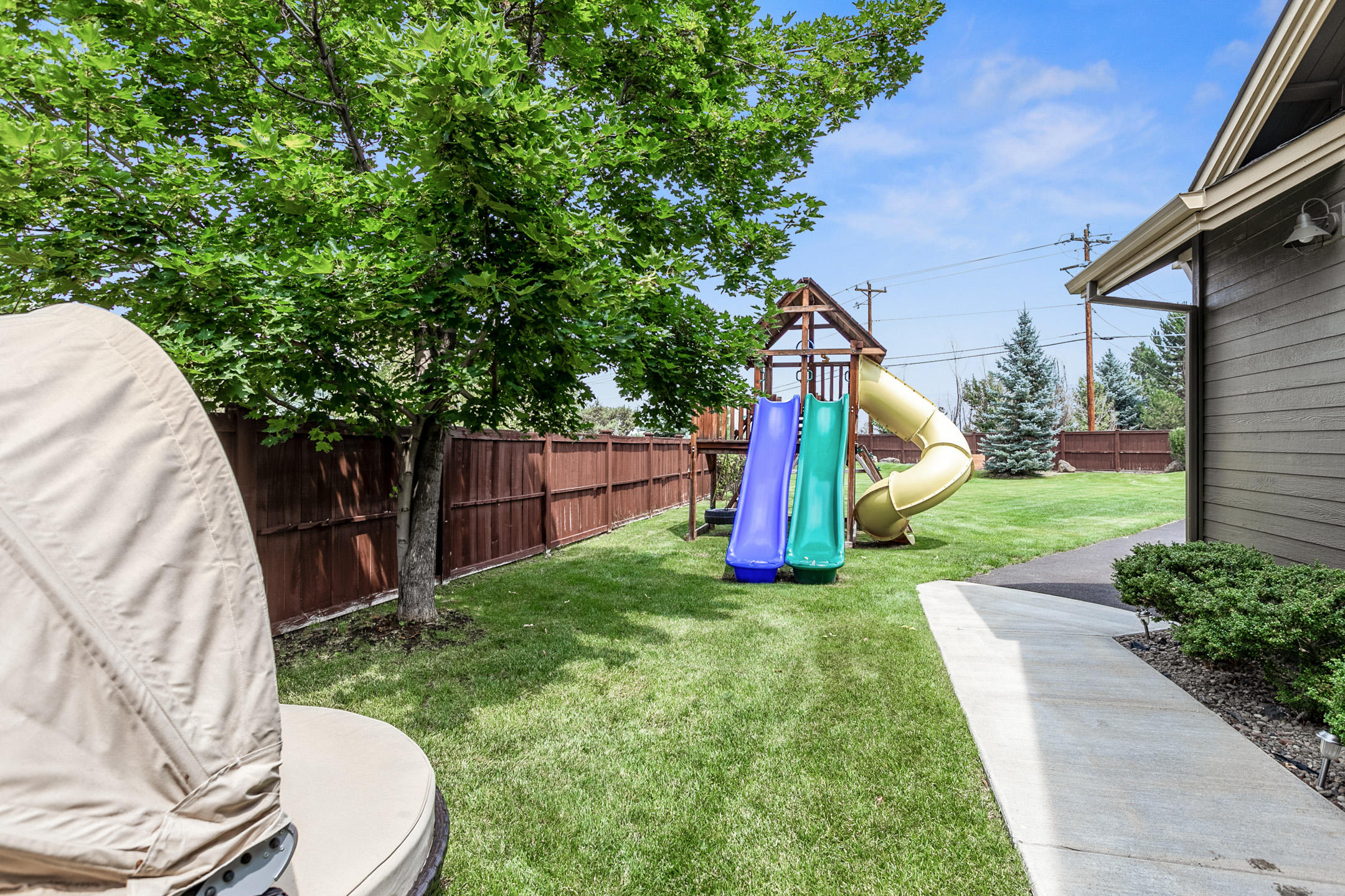62672 Larkview Road Bend, OR 97701 - Photo 4 of 39 a view of a backyard with a small cabin and a chair