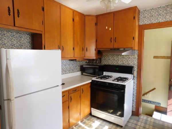 527 South 3rd Street Rochelle, IL 61068 - Photo 8 of 20 a kitchen with a stove top oven and a refrigerator