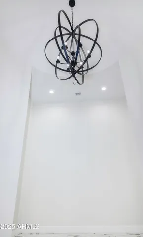 a very nice looking room with a large window and chandelier