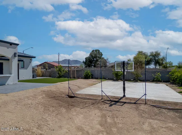 a view of entrance gate of a house with wooden fence