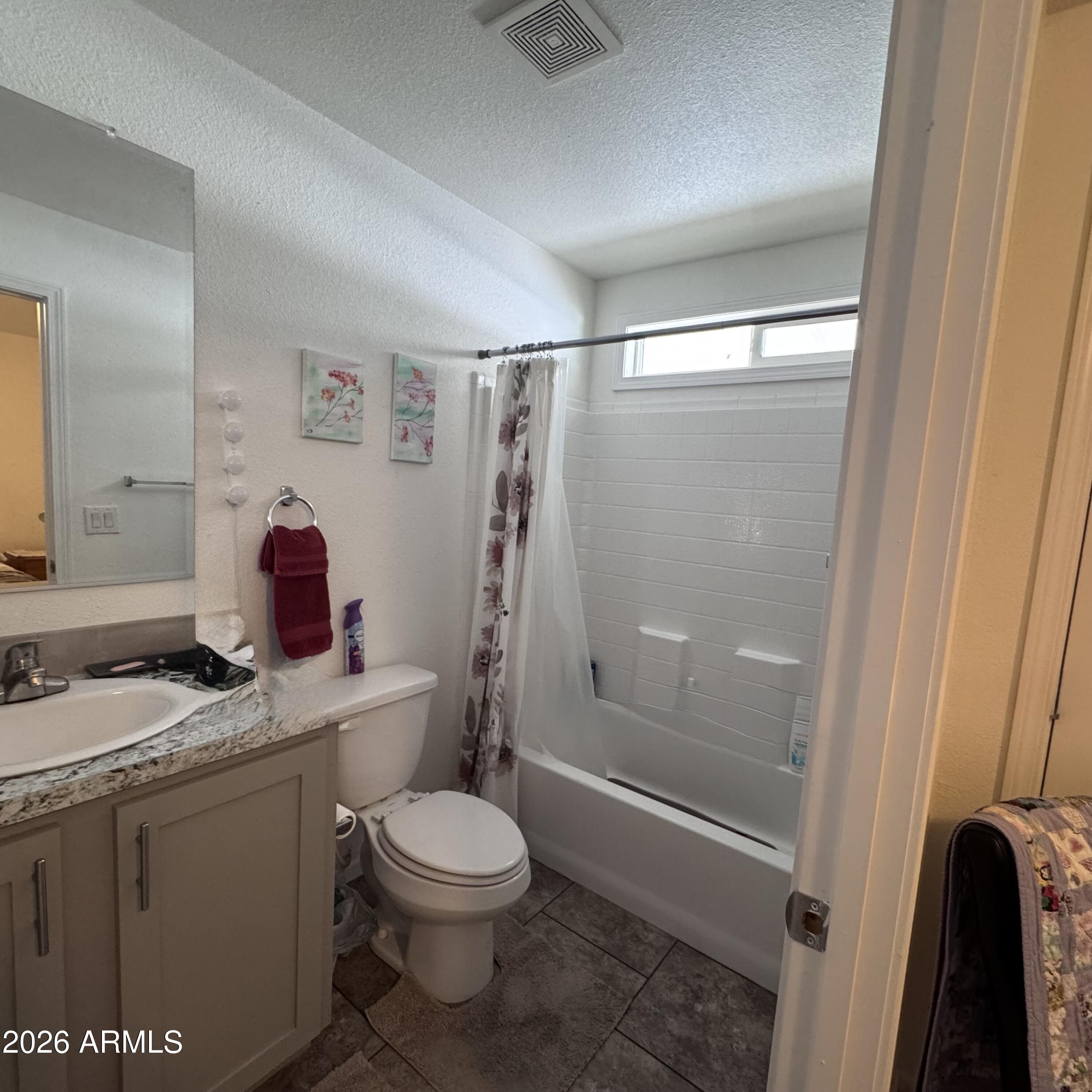 10540 East Apache Trail, Unit 15 Apache Junction, AZ 85120 - Photo 5 of 10 a white toilet sitting next to a bathroom sink