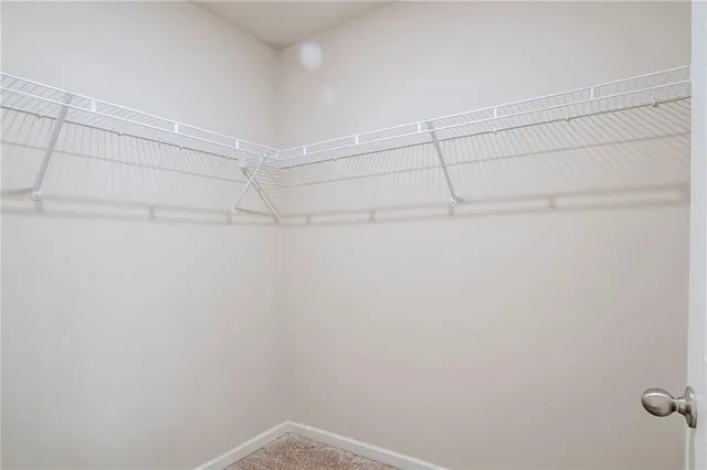 a view of a room with shelf on the wall