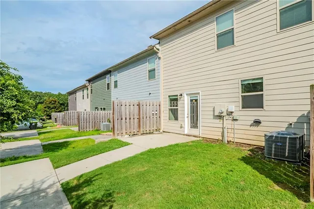 a view of a house with a yard and garden