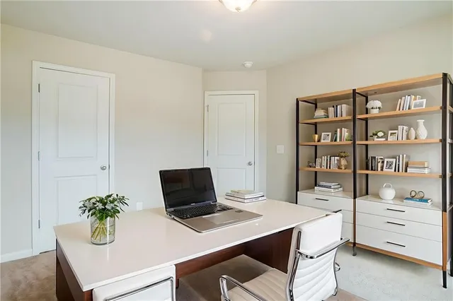 a view of a workspace with furniture
