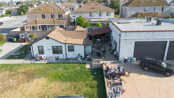 a view of a house with a yard and sitting area