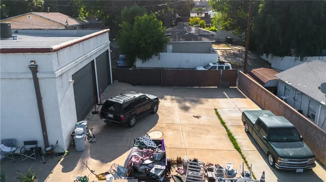 a view of a house with a yard and sitting area
