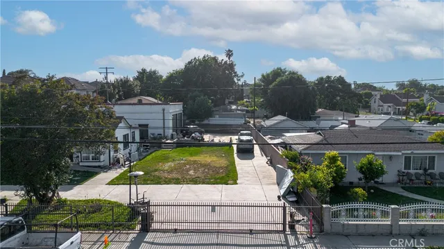 a view of a street with houses on both side