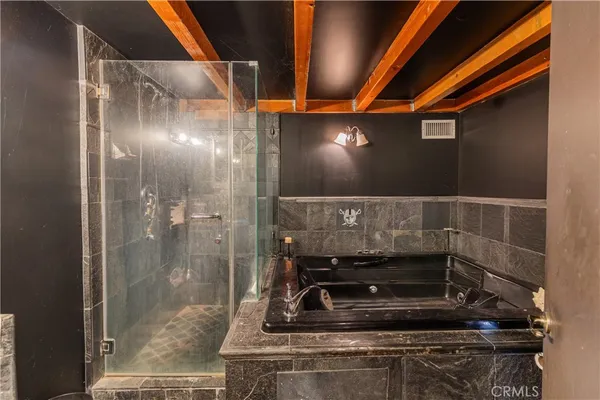 a bathroom with a sink and shower