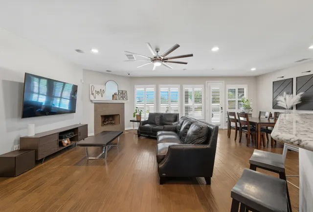 a living room with furniture fireplace and a flat screen tv