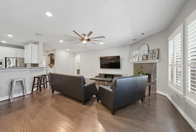 a living room with furniture and a flat screen tv