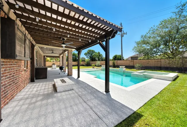 a front view of a house with a yard table and chairs