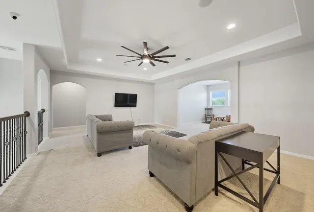 a living room with furniture and a table