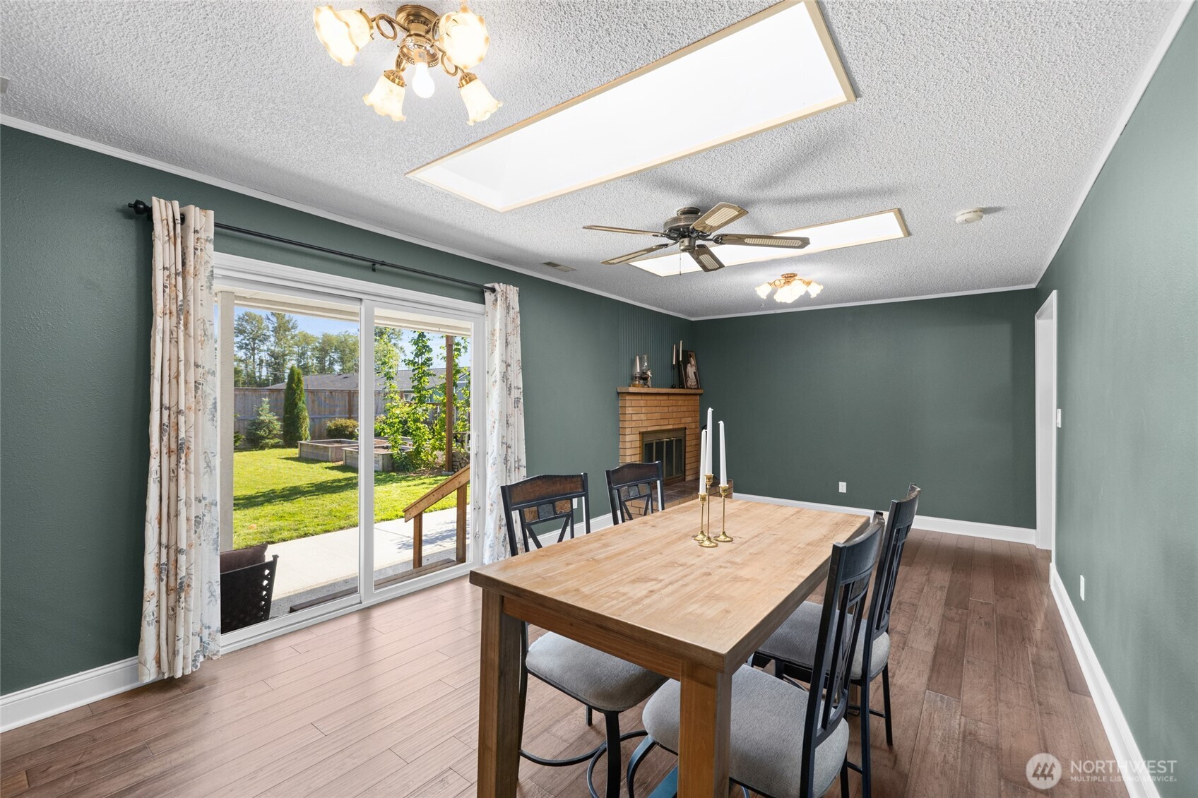 415 Sterling Street Sedro-Woolley, WA 98284 - Photo 15 of 38 a view of a dining room with furniture window and wooden floor