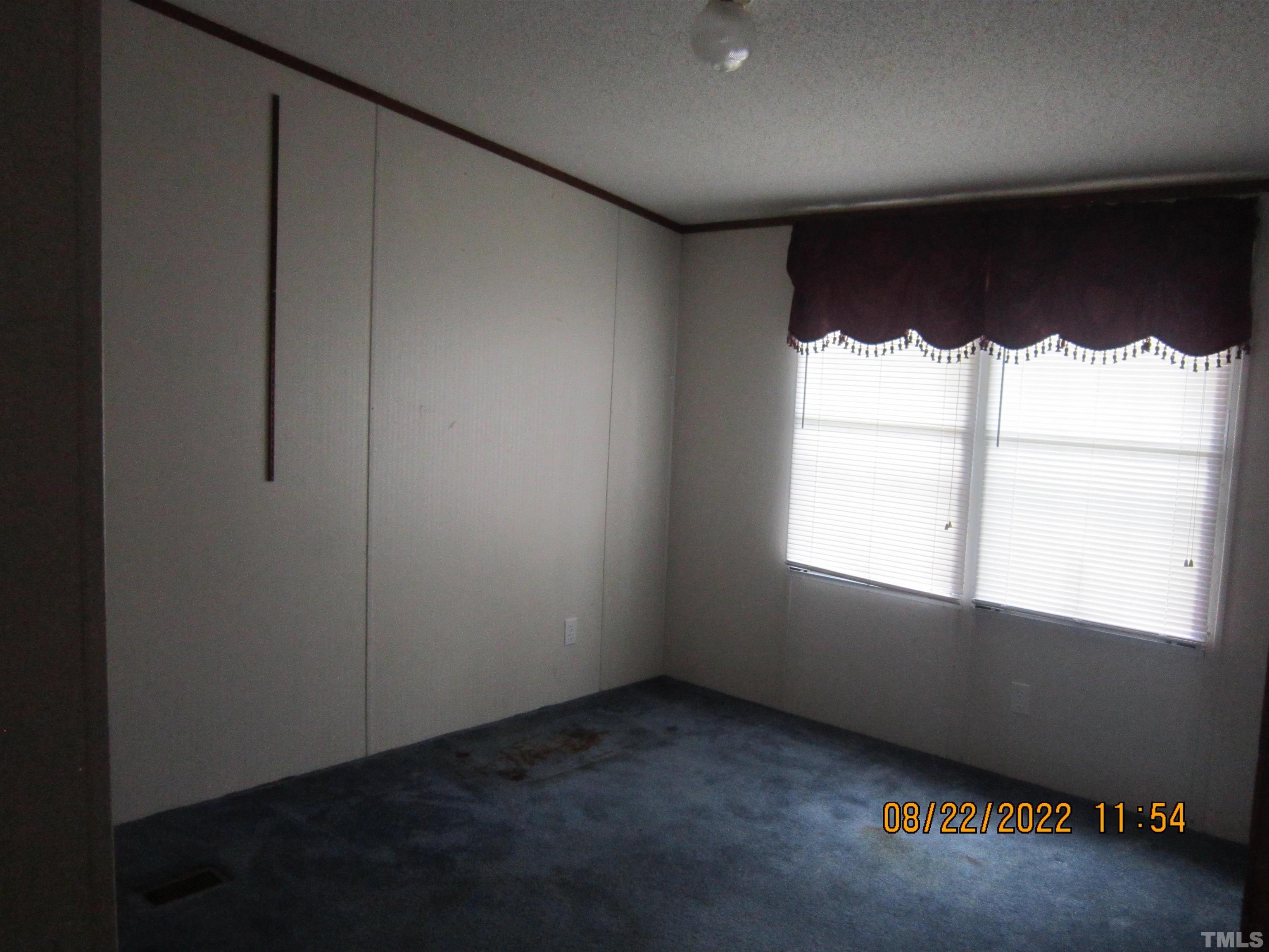 1290 Mann Oakley Road Rougemont, NC 27572 - Photo 17 of 29 an empty room with a window