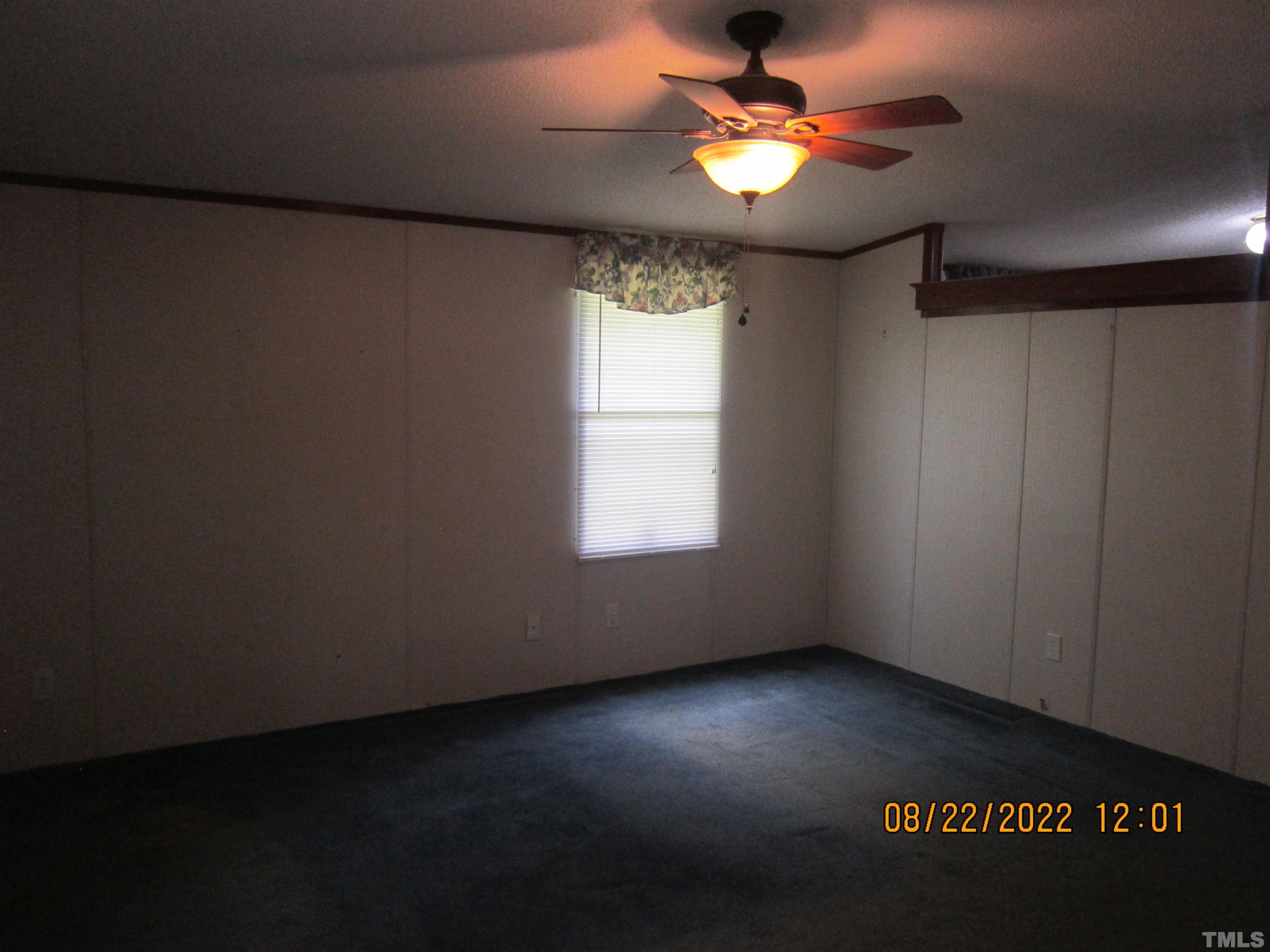 1290 Mann Oakley Road Rougemont, NC 27572 - Photo 26 of 29 a view of a livingroom with a ceiling fan and window