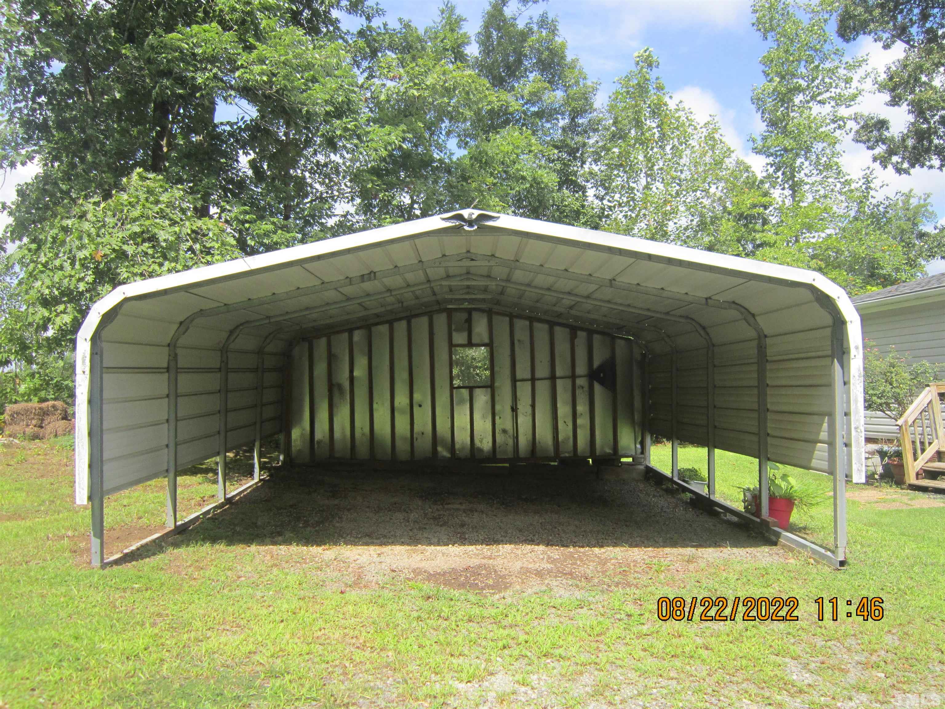 1290 Mann Oakley Road Rougemont, NC 27572 - Photo 6 of 29 a front view of a house with a yard