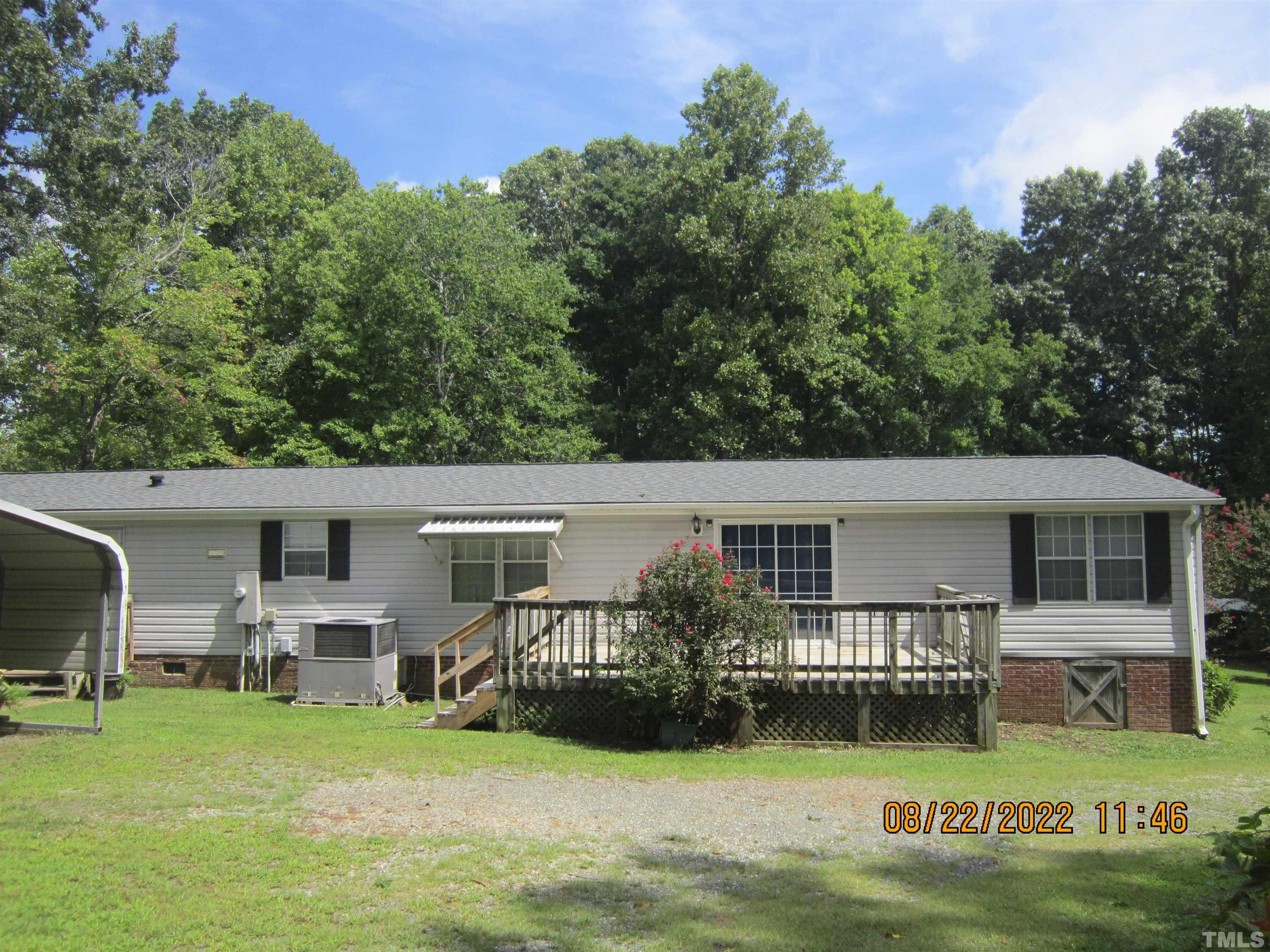 1290 Mann Oakley Road Rougemont, NC 27572 - Photo 7 of 29 a front view of a house with garden