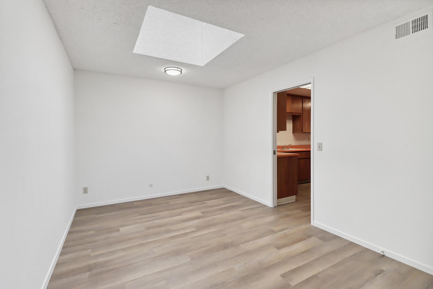 1213 Arthur Street Davis, CA 95616 - Photo 20 of 42 an empty room with wooden floor and entrance